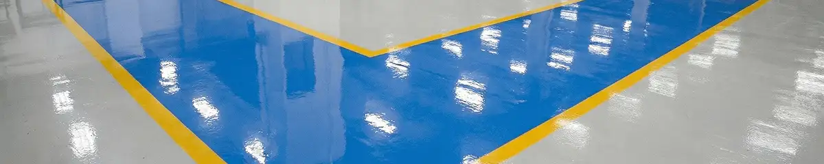 A factory floor professionally covered and marked with epoxy flooring in Lincoln, NE