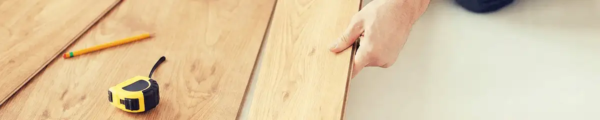 A professional installing wood flooring in Lincoln, NE