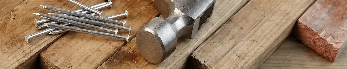 Hammer and nails on hardwood flooring boards in Lincoln, NE