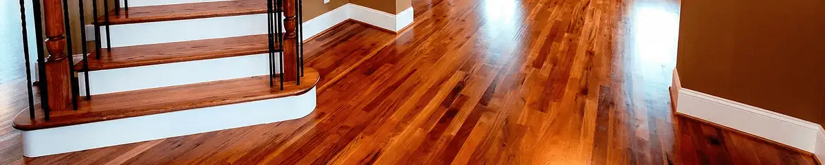 Base floor of a staircase with professionally restored wood flooring in Lincoln NE
