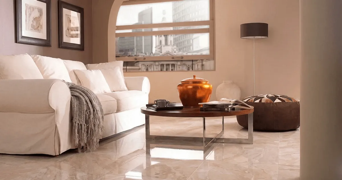 Modern living room with professionally installed marble flooring, a beige sofa, coffee table in Lincoln, NE