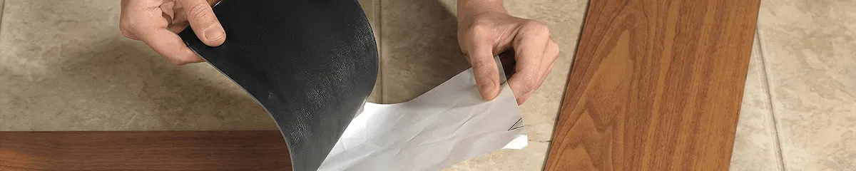 A professional installing vinyl flooring in Lincoln, NE
