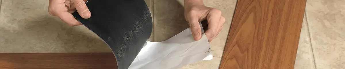 A professional installing vinyl flooring in Lincoln, NE