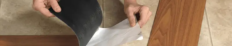 A professional installing vinyl flooring in Lincoln, NE