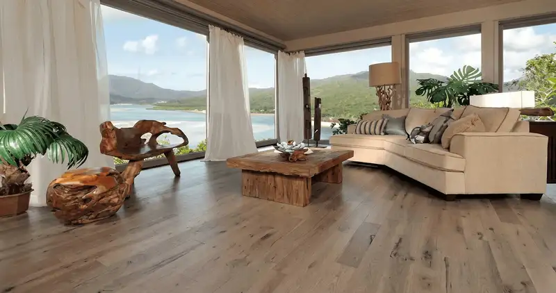Professionally installed vinyl flooring in a modern living room with large windows in Lincoln, NE