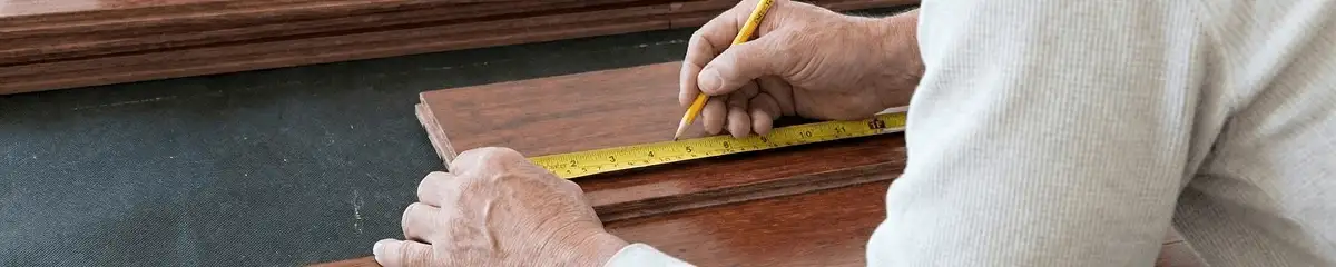 A professional installing wood flooring in Lincoln, NE